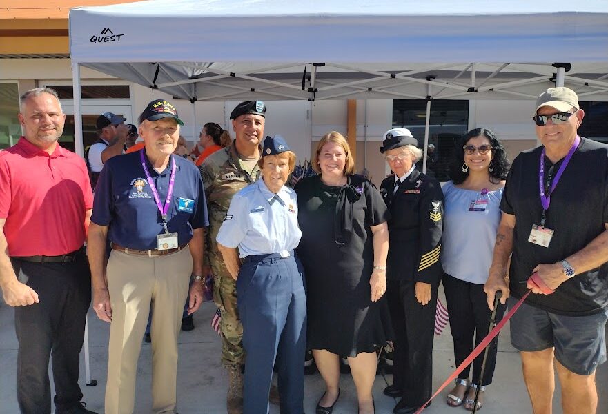 We Honor Veterans partners, volunteers, and vets gather at an event.